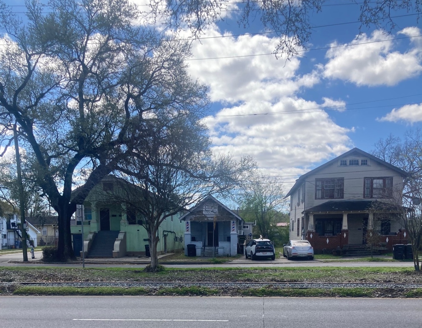 Dr. Luquet's childhood home (middle) across the street from  New Orleans’ McDonogh 19 Elementary School.