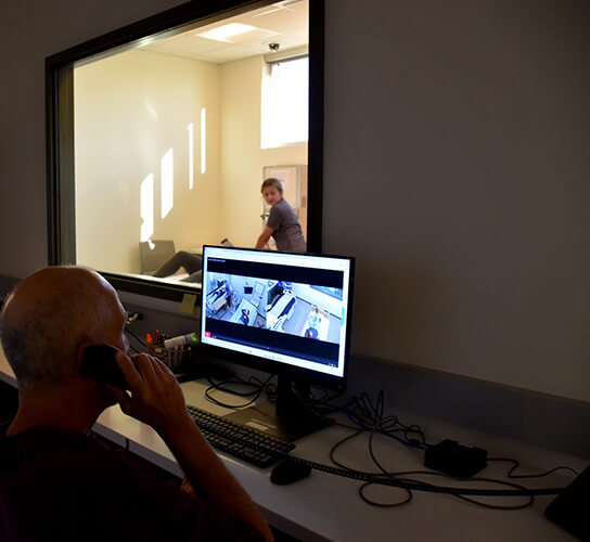 Faculty using the new nursing simulation coordinator’s suite